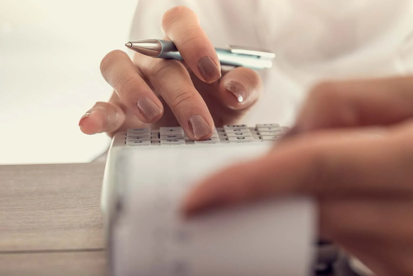 closeup-of-a-woman-using-calculator-1400px
