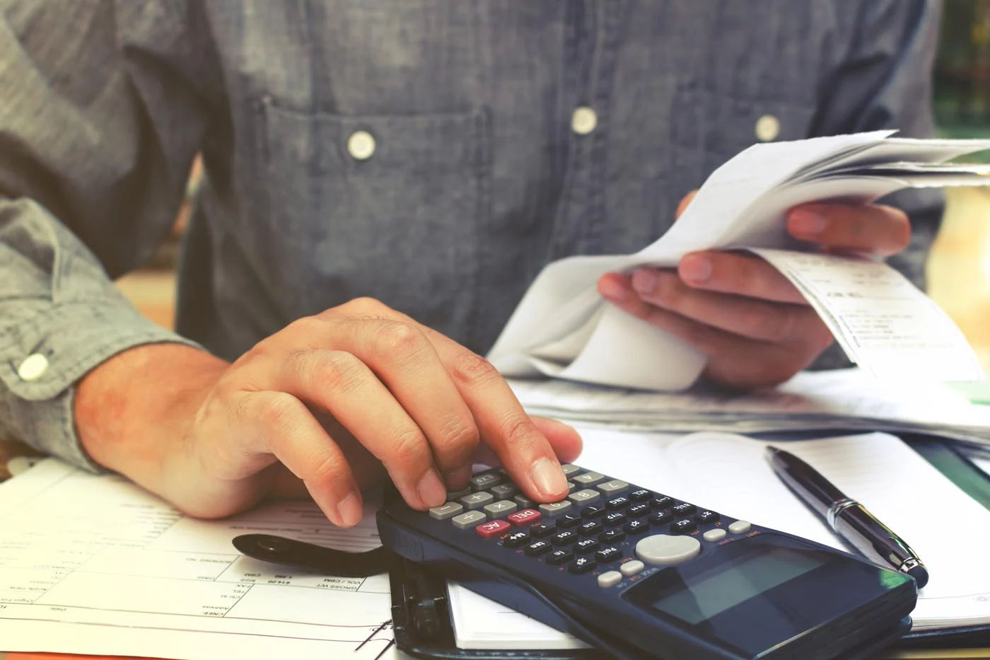 man-calculating-receipts-1400px